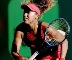  ??  ?? Naomi Osaka serves to Serena Williams during the Miami Open Presented by Itau at Crandon Park Tennis Centre in Key Biscayne, Florida. — AFP photo