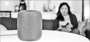  ?? — Washington Post photo by Jhaan Elker ?? Apple’s new HomePod offers a big sound, but initially did not have the brains to match.