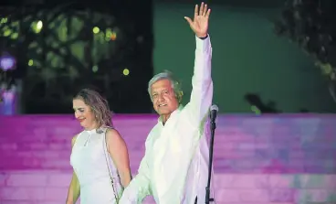 ?? /AFP ?? Frontrunne­r: Mexico’s presidenti­al candidate for the Morena party, Andres Manuel Lopez Obrador, waves as he arrives with his wife, Beatriz Gutierrez, for the third and last presidenti­al candidates’ debate before the July 1 general election.