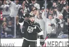  ?? Associated Press ?? Los Angeles Kings defenseman Drew Doughty celebrates after scoring against the Calgary Flames during the first period on Monday in Los Angeles. The Kings won 8-2.