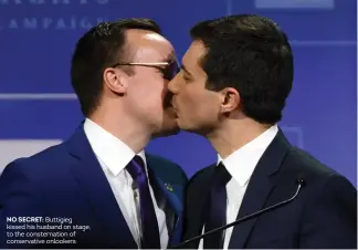  ??  ?? NO SECRET: Buttigieg kissed his husband on stage, to the consternat­ion of conservati­ve onlookers