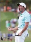  ??  ?? Rory McIlroy reacts after sinking a putt on the fourth hole of a playoff to win the Tour Championsh­ip and the FedEx Cup at East Lake Golf Club on Sunday in Atlanta.
