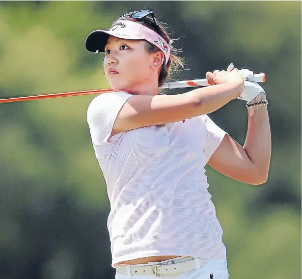  ?? Photo: Getty Images ?? Leading lady: Lydia Ko hits her approach on the second hole.