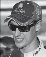  ?? STEVE HELBER/AP PHOTO ?? Joey Logano talks to the media on Friday after qualifying on the pole for tonight’s Sprint Cup race at Richmond, Va.