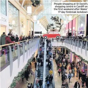  ??  ?? People shopping at St David’s shopping centre in Cardiff on the first weekend after Wales’ 17-day firebreak lockdown