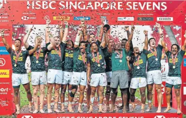  ?? Thananuwat Srirasant/Getty Images ?? Barefoot Boks: The Blitzboks celebrate winning the final of the Singapore Sevens on Sunday. /