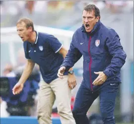  ?? Michael Steele
Getty Images ?? ANDREAS HERZOG, right, and Juergen Klinsmann react at a World Cup match last year. Herzog is using Klinsmann’s style to develop the U.S. under-23 team.