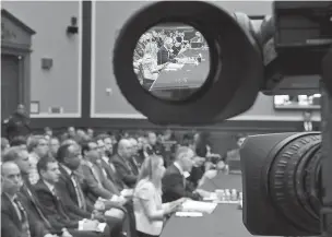  ??  ?? Environmen­tal Protection Agency Administra­tor Scott Pruitt is seen through a television camera viewfinder Thursday while testifying before the House Energy and Commerce subcommitt­ee hearing on Capitol Hill in Washington.