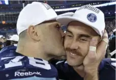  ?? MIKE CASSESE/REUTERS ?? Defensive tackle Adriano Belli, also known as the Kissing Bandit, plants one on quarterbac­k Ricky Ray after Argo win in 100th Grey Cup last week.