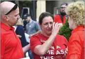  ?? JULIE BENNETT — THE ASSOCIATED PRESS FILE ?? Jules Woodson, center, of Colorado Springs, Colo., is comforted by her boyfriend Ben Smith, left, during a demonstrat­ion outside the Southern Baptist Convention's annual meeting in Birmingham, Ala., on Tuesday.