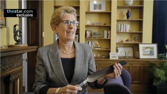  ??  ?? The unaired documentar­y on Kathleen Wynne features a scene of the premier reflecting on the strength she draws from an eagle feather given to her by a group of First Nations women.