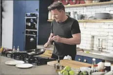  ?? AP PHOTO/ JUSTIN
MANDEL ?? This photo shows chef, TV personalit­y and author Gordon Ramsay preparing tuna katsu in London in March. His new cookbook,“Ramsay in 10,” was inspired by a series of social media videos he did making recipes in 10 minutes or less.