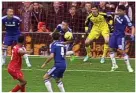  ??  ?? Simon Mignolet fails to stop Gary Cahill’s shot squirming over the line. Cahill was then lucky to get away with handball from Raheem Sterling’s shot (above) although Anthony Taylor’s view may have been obstructed