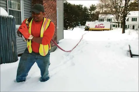  ?? Ned Gerard / Hearst Connecticu­t Media file photo ?? A Santa Energy driver makes a heating oil delivery in Fairfield. Connecticu­t heating oil prices were inching up in late August, creating a guessing game for homeowners as they look to lock in contracts for the heating season that starts in October.