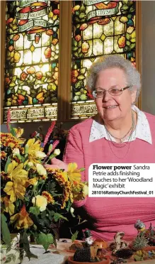  ??  ?? Flower power Sandra Petrie adds finishing touches to her ‘Woodland Magic’ exhibit