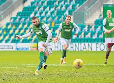  ??  ?? Hibs Martin Boyle drives home from the penalty spot to put the men from Leith in front