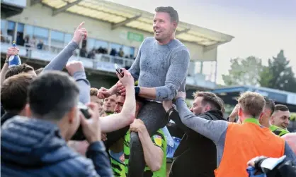  ?? ?? Rob Edwards gets a lift as Forest Green celebrate at Bristol Rovers after winning promotion to League One. Photograph: Adrian Sherratt/ The Guardian