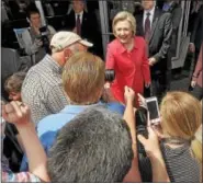  ?? GENE WALSH — DIGITAL FIRST MEDIA ?? Democratic presidenti­al candidate Hillary Clinton shakes hands as she leaves Curds & Whey in Jenkintown after a Breaking Economics Barrier Conversati­on with Lilly Ledbetter on Friday.