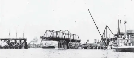  ?? CITY OF VICTORIA ARCHIVES, IMAGE M00320 ?? The E&N swing bridge at the time of the Johnson Street Bridge constructi­on.