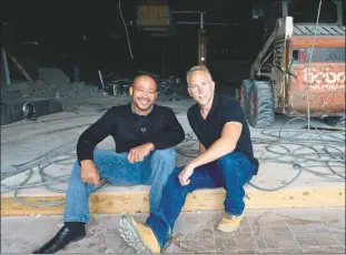  ?? STAFF PHOTOS BY DARWIN WEIGEL ?? Sky Zone general manager Frederick Curry, left, and owner Paul V. Facchina Jr., both of La Plata, pause from their work for a photo amid the constructi­on at the Flooring America building in White Plains.