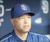  ?? Gregory Bull Associated Press ?? THE DODGERS’ first minority manager, Dave Roberts calls his new job “the opportunit­y of a lifetime.”