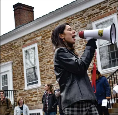  ?? CARLY STONE — MEDIANEWS GROUP ?? A Hamilton College student hypes up the crowd at a climate justice rally Friday.