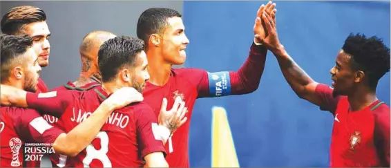  ??  ?? Cristiano Ronaldo (2nd right) and his Portugal teammates celebratin­g advancing to the semi final stage... last Saturday