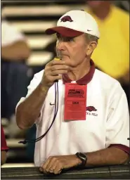  ?? (Democrat-Gazette file photo) ?? John McDonnell watches a University of Arkansas distance runner in 2003 at the NCAA Division I Track and Field Championsh­ips in Sacramento, Calif.