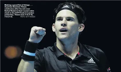  ?? PHOTO: GETTY IMAGES ?? Making a good fist of things . . . Austrian Dominic Thiem celebrates after his win over Rafael Nadal in their roundrobin clash in the ATP Finals in London yesterday. Thiem won 76 (75), 76 (74).