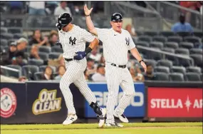  ?? Frank Franklin II / Associated Press ?? The New York Yankees’ Phil Nevin, right, celebrates with Joey Gallo as he runs the bases after hitting a home run during the sixth inning against the Texas Rangers in September.