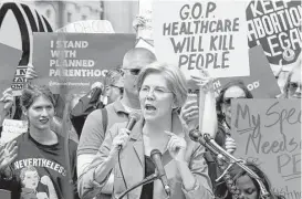  ?? Jose Luis Magana / Associated Press ?? Sen. Elizabeth Warren D-Mass. speaks during a demonstrat­ion Thursday on Capitol Hill against the Republican health care bill passed by the House.