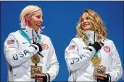  ?? HILARY SWIFT / THE NEW YORK TIMES ?? Kikkan Randall (left) and Jessie Diggins won the gold medal in the team sprint. It was the first medal won by American women in cross-country.