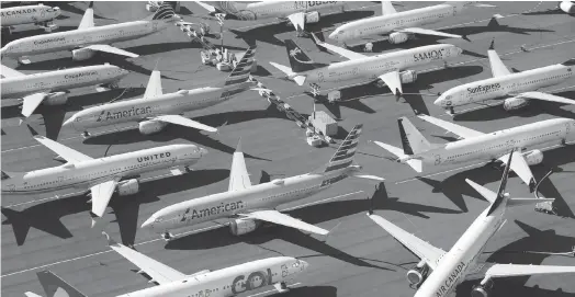  ?? REUTERS ?? Grounded Boeing 737 MAX aircraft are seen parked in an aerial photo at Boeing Field in Seattle, Washington.