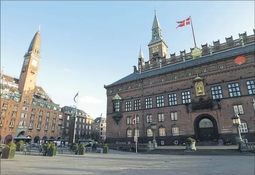  ?? PHOTOGRAPH: MARTIN SHIELDS ?? Above: Copenhagen shares the same levels of winter sunlight as Glasgow yet Denmark tops the UN World Happiness Report while the UK languishes in 23rd place. Below: a dram is classicall­y hygge, along with blankets, gentle conversati­on and cake