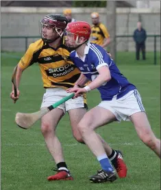  ??  ?? Rathnure’s Ciaran O’Connor collides with Oylegate-Glenbrien’s Mike Kelly at Bellefield.