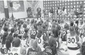  ??  ?? Stephen Curry, top center, asked the Warriors to plan an all-girls camp session this summer.