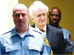  ??  ?? Radovan Karadzic appears in a courtroom before the Internatio­nal Residual Mechanism for Criminal Tribunals (MICT), which is handling outstandin­g war crimes cases for the Balkans and Rwanda, in The Hague. — Reuters photo