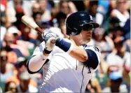  ?? AP PHOTO BY CARLOS OSORIO ?? Detroit Tigers designated hitter Victor Martinez watches his RBI single to right during the fourth inning of a baseball game against the San Francisco Giants, Tuesday, in Detroit.