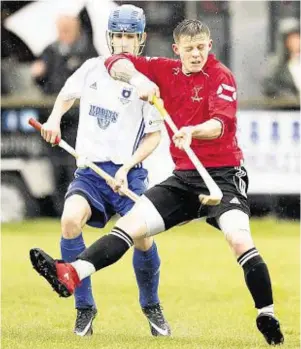  ??  ?? One false move: Martin Mainland, Lovat, front, is closely watched by Calum McLay, of Glasgow Mid Argyll in the Premiershi­p game at Kiltarlity