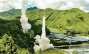  ?? CCTV ?? A projectile launches Thursday from an unspecifie­d location in China. Its “precision missile strikes” into the Taiwan Strait during military exercises have raised regional tensions.