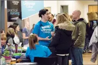  ?? Herald photo by Greg Bobinec ?? Lethbridge College faculty talk with future students and their families about the programs and services the college offers at the annual Open House Saturday afternoon.