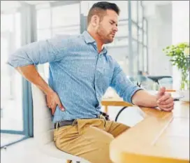  ?? PHOTO: ISTOCK ?? Bad posture, poor diet and stress are some of the triggers for back pain