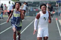  ?? Jeremy Stewart ?? Rockmart’s Tyshawn Johnson (right) pushes ahead of Eagle Landing Christian Academy’s Jacque Holley during the Class AA “B” sectional at Rockmart High School on Saturday, May 6.