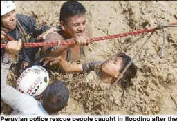  ?? EPA ?? Peruvian police rescue people caught in flooding after the Rimac and Huaycoloro rivers in Lima, Peru overflowed Friday.