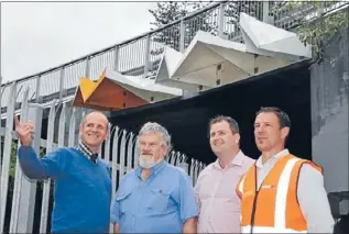  ??  ?? Safety first: Auckland Council public arts team project co-ordinator Kim Martinengo discusses the new screens at the Dominion Rd overbridge with Eden–Albert Local Board member Graham Easte, KiwiRail project manager Kevin McConnell and contractor...
