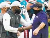  ?? CHRIS O'MEARA AP ?? Patriots coach Bill Belichick (right) greets Dolphins coach Brian Flores after a loss at Miami.