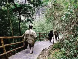  ??  ?? The hike to Three Natural Bridges in Wulong.