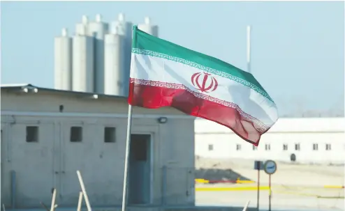  ?? ATTA KENARE / AFP via Gett y Imag es files ?? An Iranian flag flutters in Iran’s Bushehr nuclear power plant. The Iran nuclear deal “led to self- delusion and, ultimately, the deception of the American people,” writes former U. S. national security adviser H.R. Mcmaster.