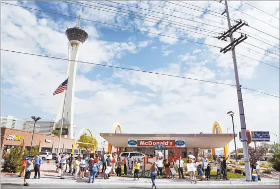  ?? PHOTOS BY LEILA NAVIDI ?? Local fast-food workers were joined by union workers and sympathize­rs as they went on strike for higher wages.