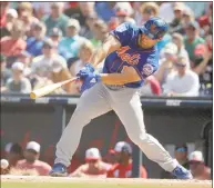  ?? Brynn Anderson / Associated Press ?? The Mets’ Tim Tebow bats in an exhibition spring training game against the Nationals on March 7 in West Palm Beach, Fla.